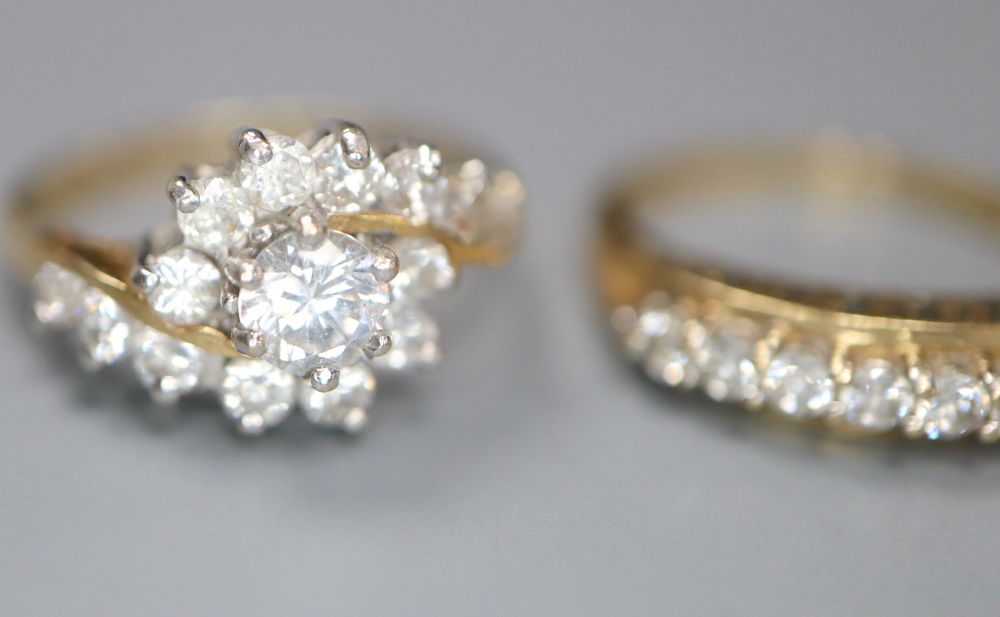 Five assorted modern 14ct gold and CZ set dress rings, gross 13 grams.
